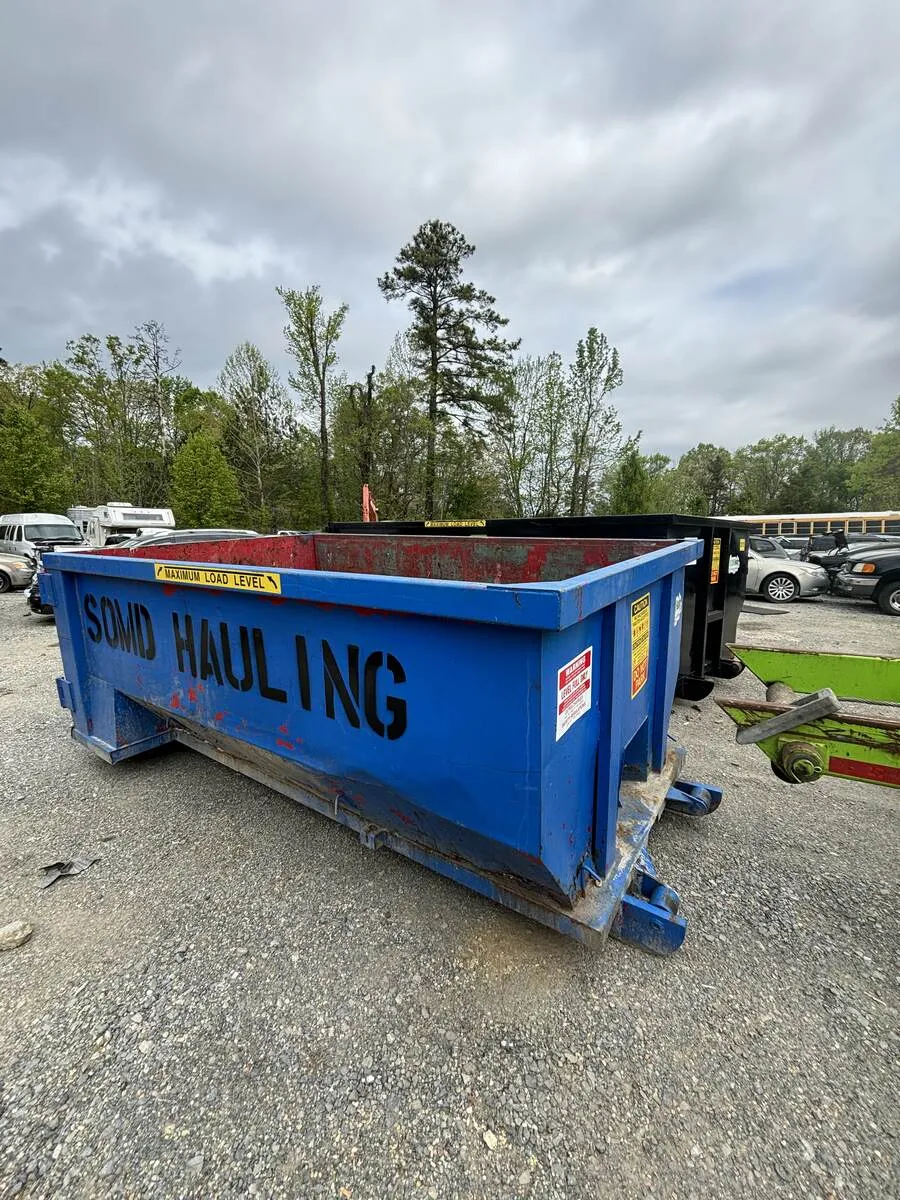 SOMD Hauling roll-off dumpster truck with company branding and USDOT number